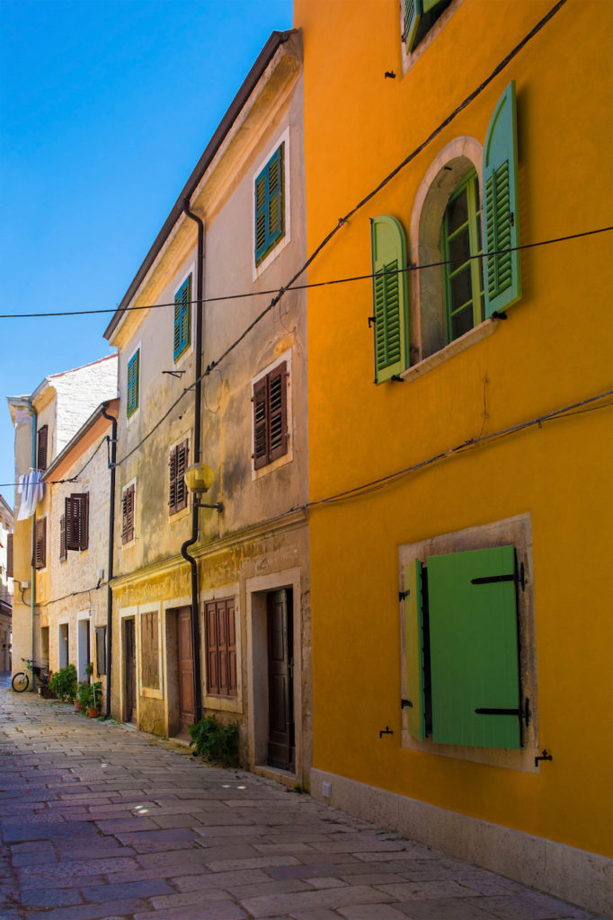 A quiet back street in the historic medieval coastal town of Porec in Istria, Croatia