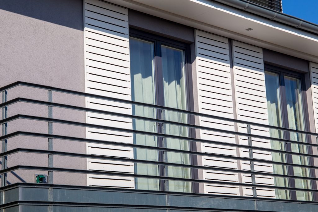 Windows with modern sliding shutters