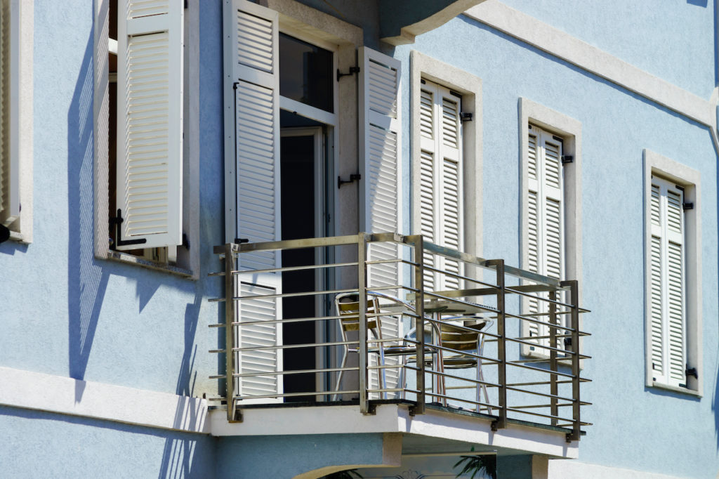 House with balcony on sea resort, sunny day, touristic concept. Croatia